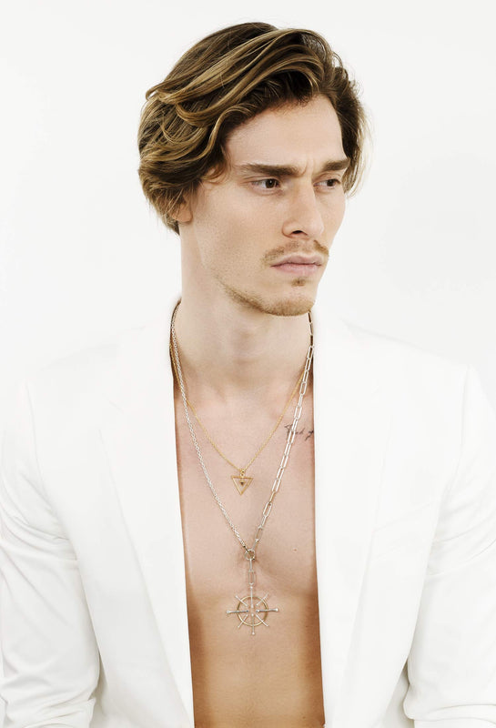man-wearing-singula-necklace-silver-gold-precious-stones-white-blazer